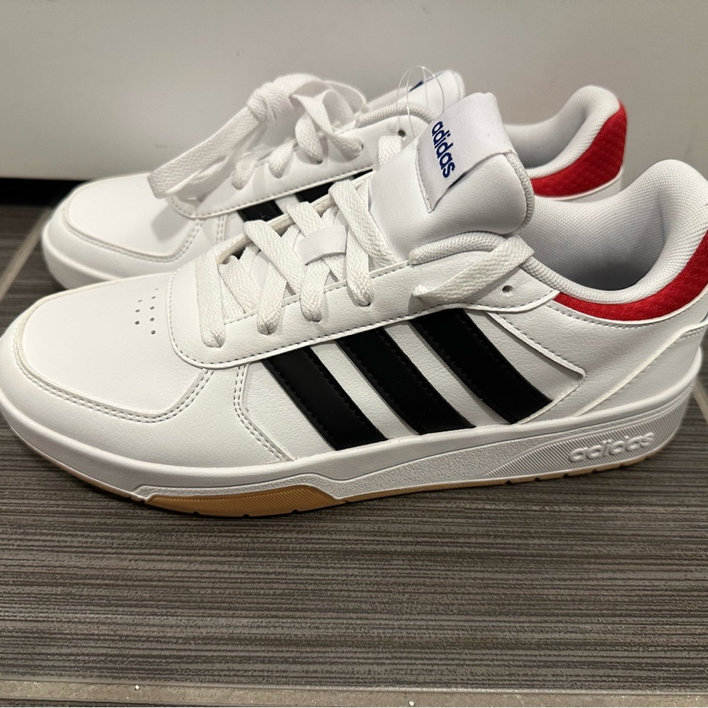 Adidas White Sneakers with Black Stripes and Red Heel